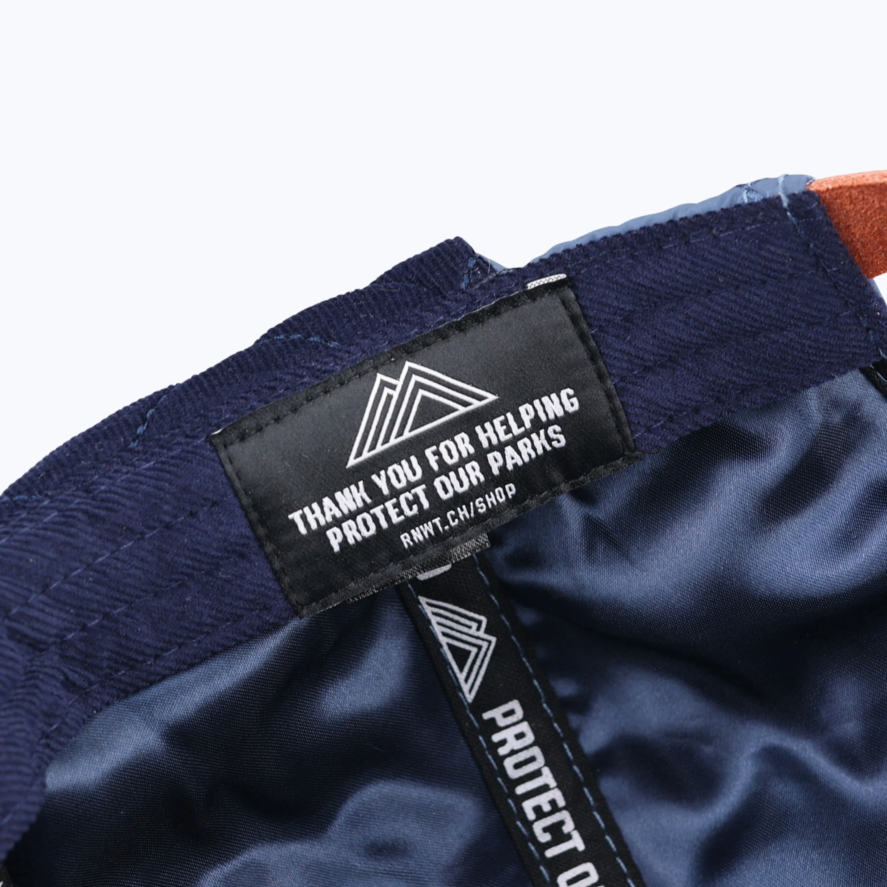 Protect Our Parks Bear 7 Panel Quilted Trapper Outdoor Cap - Navy/Orange - Image 4